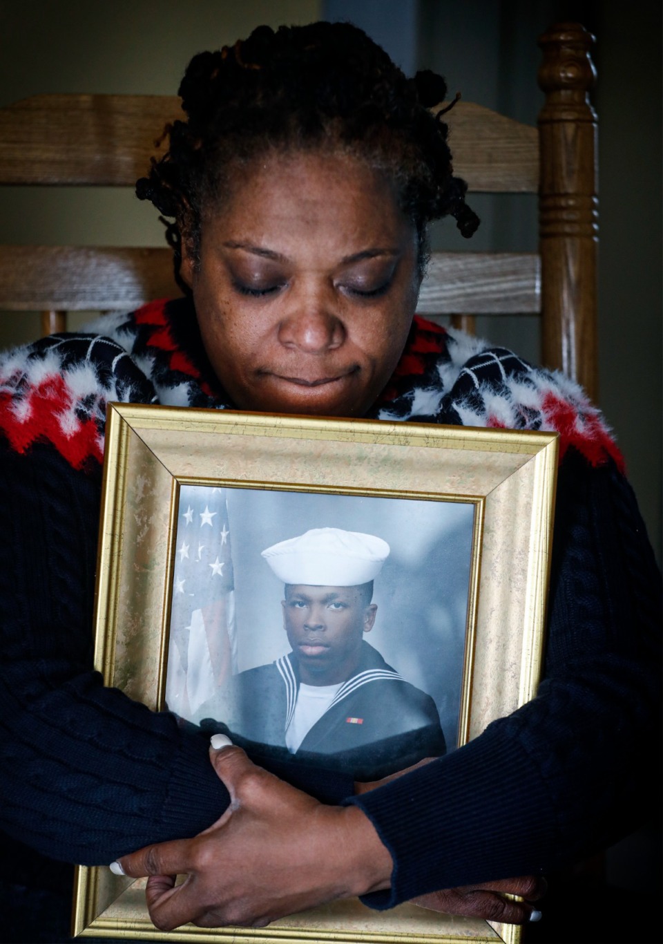 <strong>JoAnn Lewis hugs a portrait of her deceased son, Jerod Lewis, on Friday, Dec. 17, in her home. &ldquo;We need to change these gun laws,&rdquo; Lewis said.</strong>&nbsp;(Mark Weber/Daily Memphian)