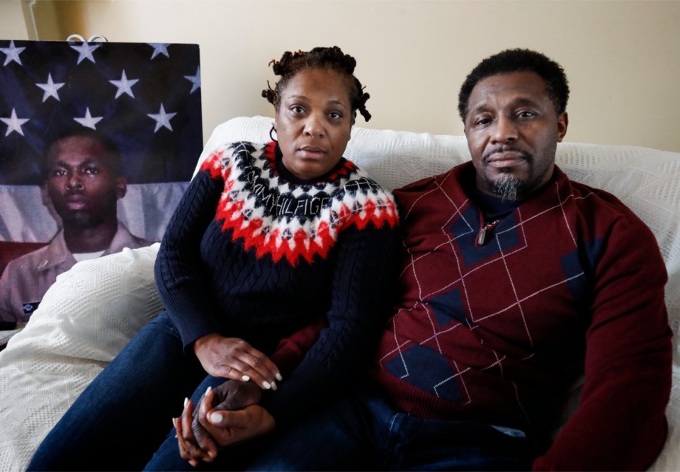 <strong>JoAnn and Darrell Lewis sit near a portrait of their deceased son, Jerod Lewis, on Friday, Dec. 17, in their home. Jerod was shot and killed on Aug. 3, 2012, while driving on Perkins Road and Interstate 240. He was 25.</strong> (Mark Weber/Daily Memphian)