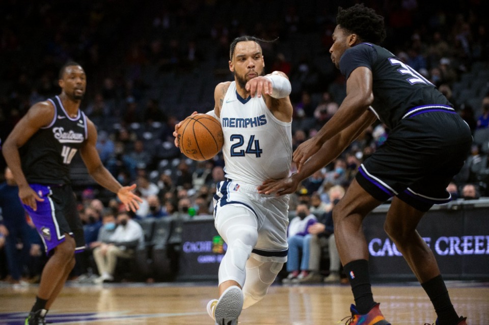 <strong>Grizzlies forward Dillon Brooks (24) drives to the basket as Sacramento Kings center Damian Jones (30) defends in Sacramento, California, on Dec. 17, 2021.</strong> (Randall Benton/AP)