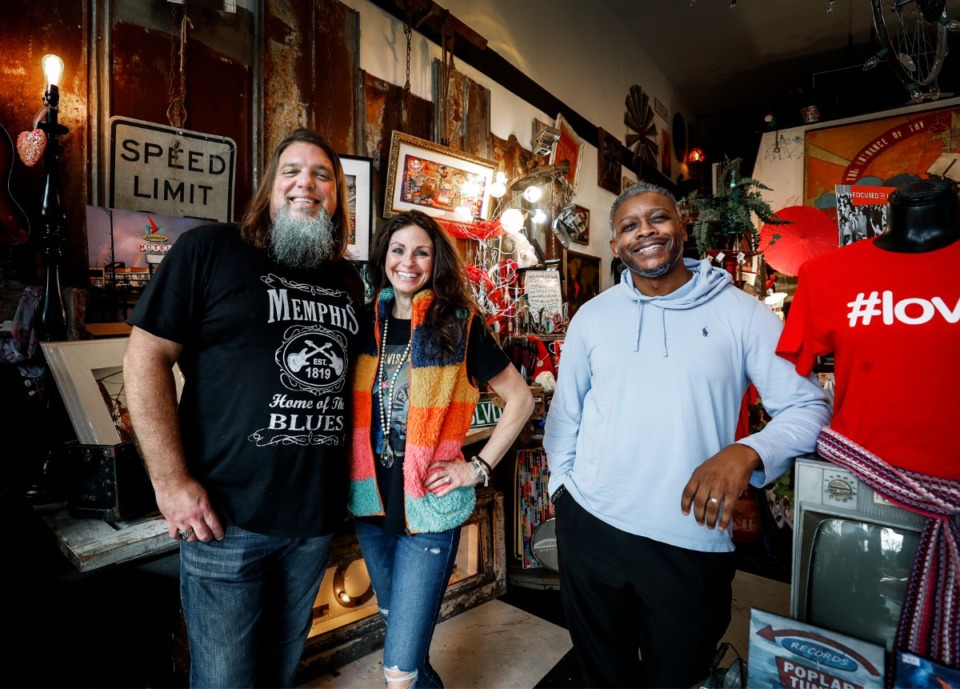 <strong>Daryl Andrews (left) and Ashley Parham (middle), owners of Walking Pants Curiosities, stand in their store with Princeton James Productions COO Fenton Wright on Thursday, Dec. 16. Andrews and Parham have teamed up with the local production company to shoot a television series rehabbing 13 Downtown businesses.</strong> (Mark Weber/Daily Memphian)