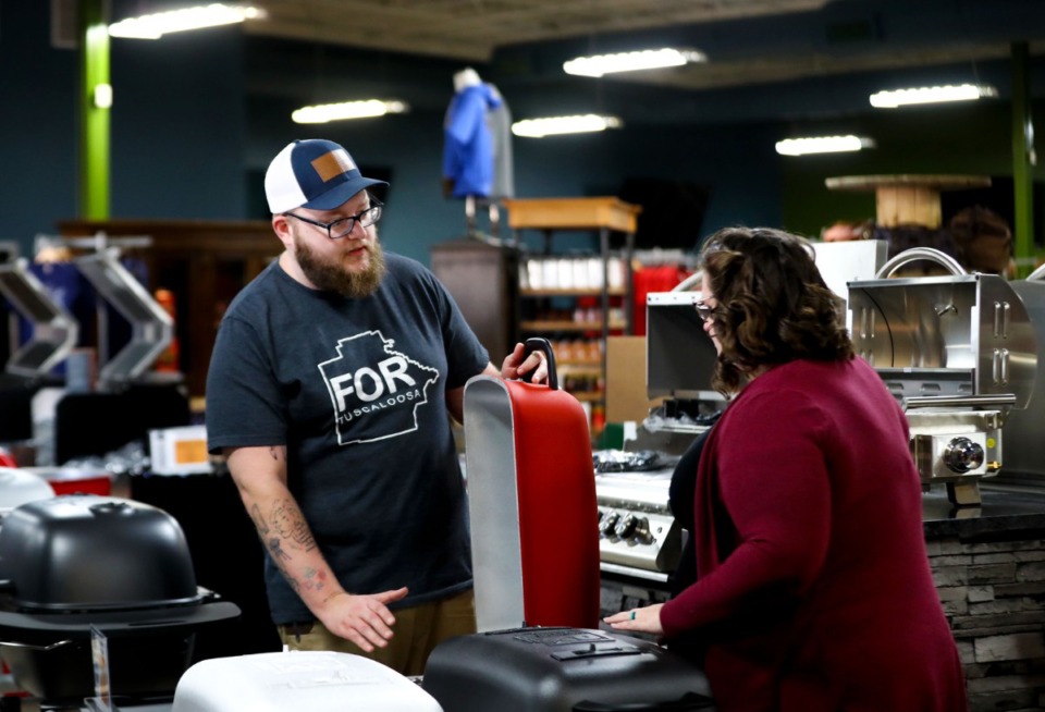 <strong>Joshua and Emily Williamson shop for grills at the BBQ Allstars store in Southaven, Mississippi Dec. 21, 2021.</strong> (Patrick Lantrip/Daily Memphian)