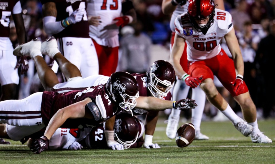 <strong>Mississippi State University linebacker Sherman Timbs (34) dives for a loose ball against Texas Tech during the 63rd AutoZone Liberty Bowl on Dec. 28, 2021.</strong> (Patrick Lantrip/Daily Memphian)