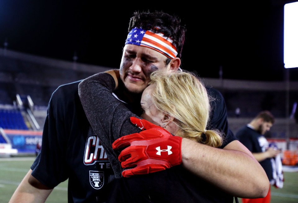 <strong>Texas Tech University lineman Gabe Cavazos Jr. (68) hugs his mom after his team defeated Mississippi State University at the 63rd AutoZone Liberty Bowl on Dec. 28, 2021.</strong> (Patrick Lantrip/Daily Memphian)