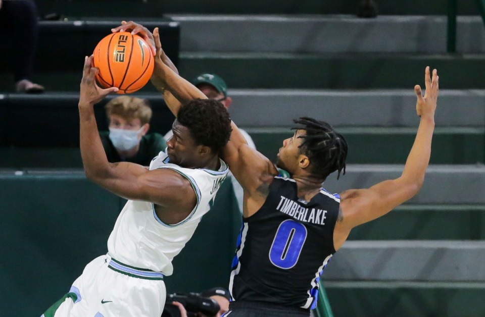 <strong>Tiger Earl Timberlake (0) tries to block Tulane&rsquo;s Sion James, left, on Dec. 29, 2021.</strong> (David Grunfeld/The Times-Picayune/The New Orleans Advocate via AP)