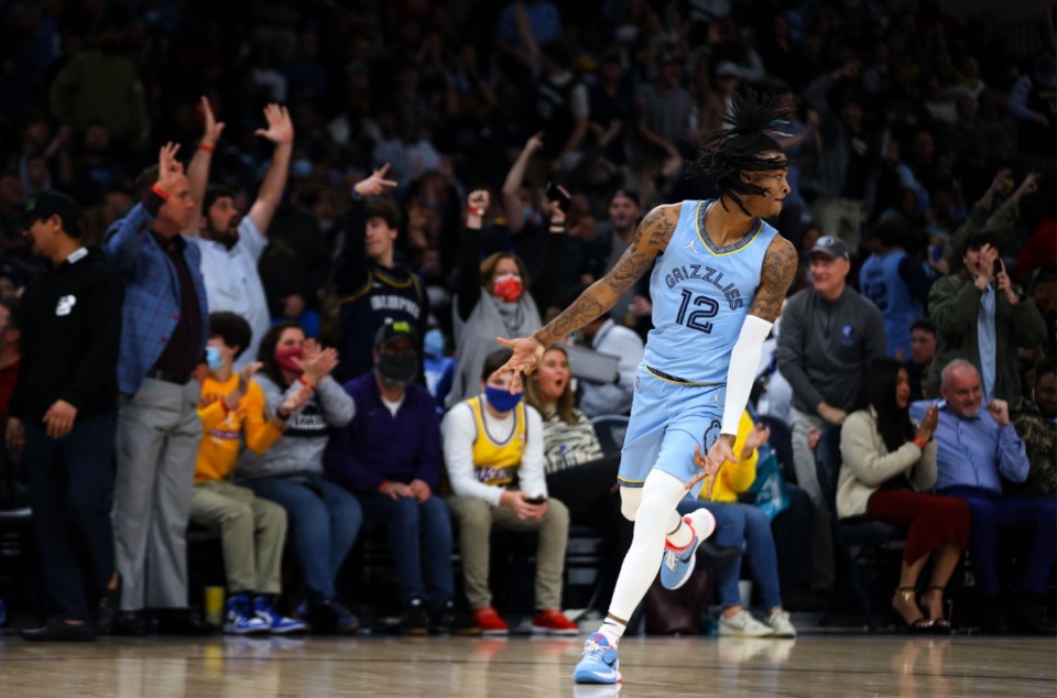 <strong>Grizzlies guard Ja Morant (12) celebrates after a huge three-pointer against the Los Angeles Lakers on Dec. 29 at FedExForum.</strong> (Patrick Lantrip/Daily Memphian)