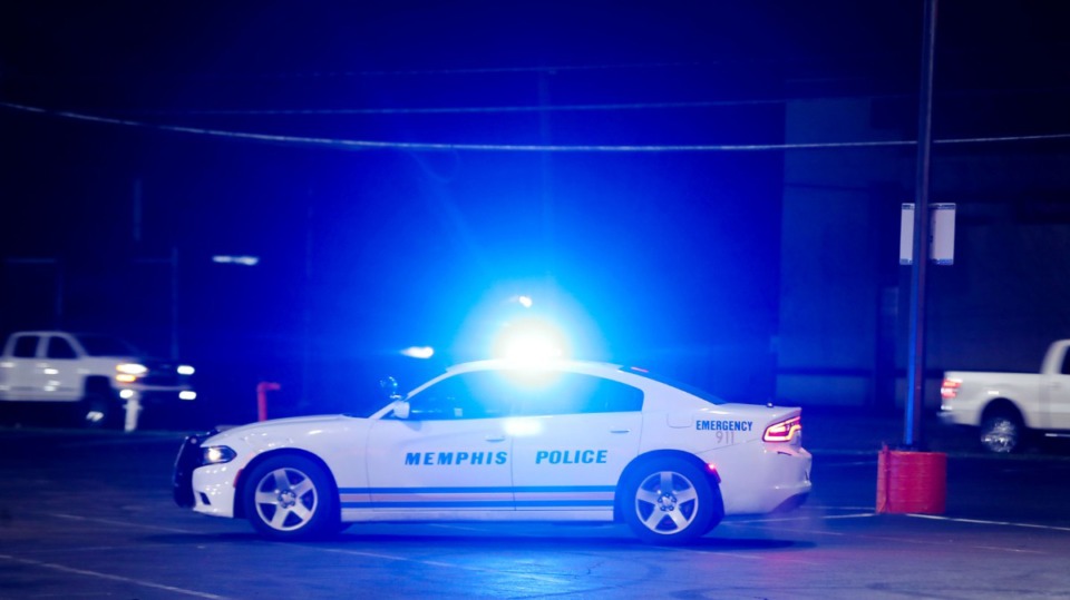 <strong>Memphis police officers chase speeding cars from an AutoZone parking lot in Berclair Dec. 11, 2021.</strong> (Patrick Lantrip/Daily Memphian)