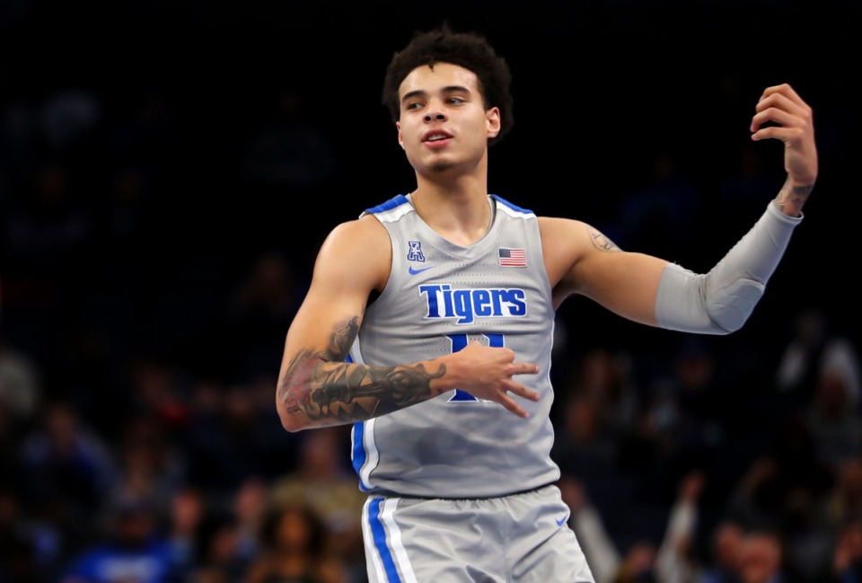 <strong>Memphis guard Lester Quinones (11) plays the air guitar after a three-pointer on Jan. 4, 2022, in the game against the University of Tulsa at FedExForum.</strong> (Patrick Lantrip/Daily Memphian)