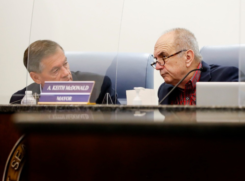 <strong>Chief Administrative Officer Mark Brown and Mayor A. Keith McDonald (right) converse during a meeting of The Bartlett Board of Mayor and Aldermen on Tuesday, May 25, 2021.</strong> (Mark Weber/The Daily Memphian file)
