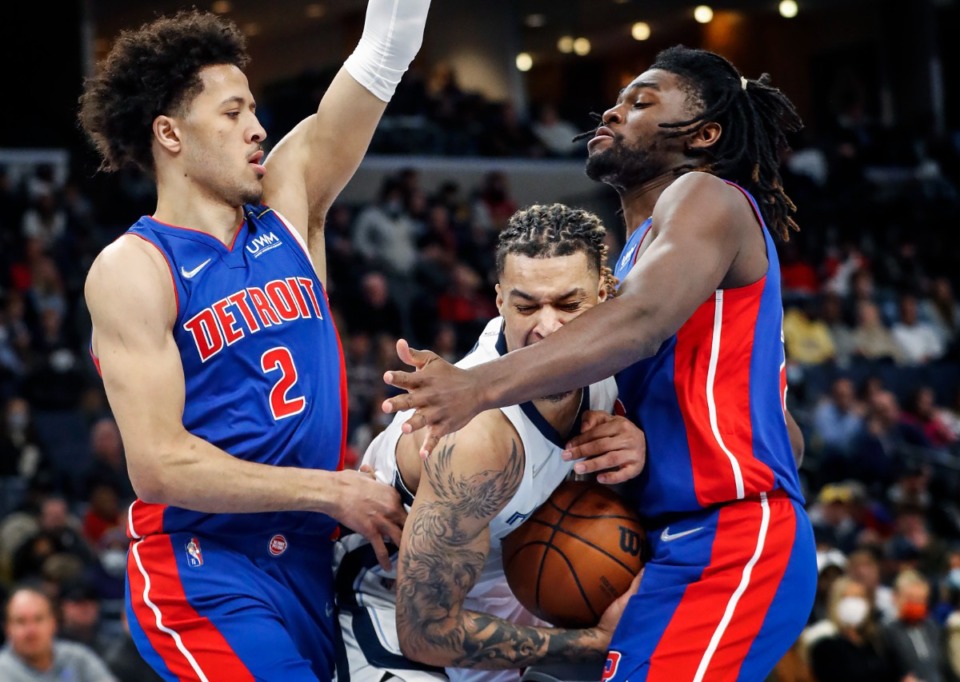 <strong>Grizzlies forward Brandon Clarke (middle) grabs a rebound against Detroit&rsquo;s Cade Cunningham (left) and Isaiah Stewart (right) on Thursday, Jan. 6, 2022.</strong> (Mark Weber/The Daily Memphian)