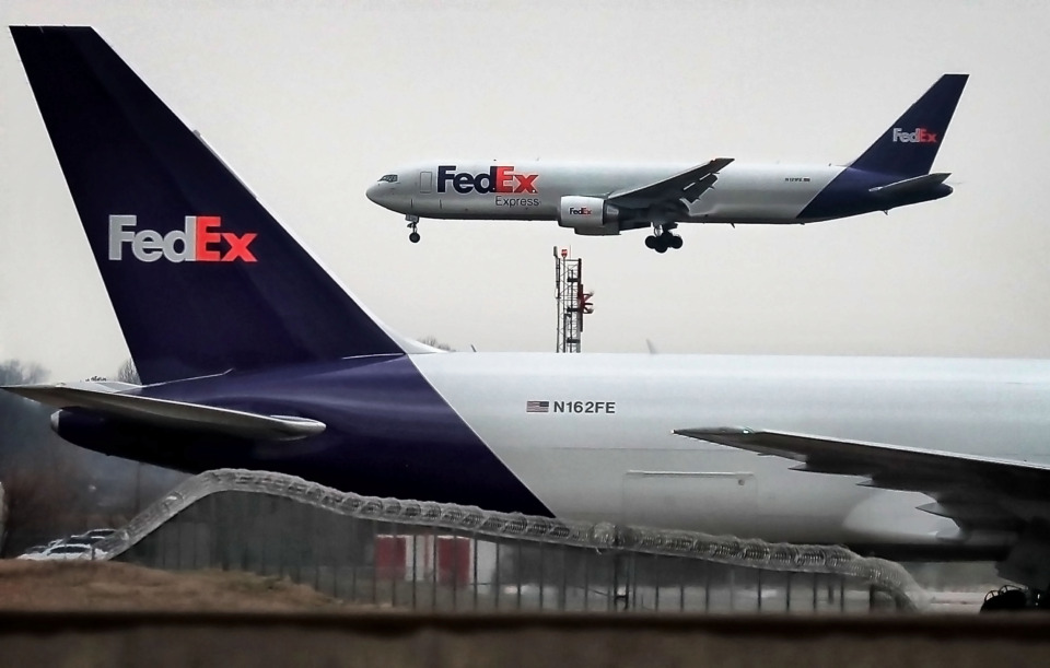 <strong>FedEx Express planes land at Memphis International Airport during an bus tour of the airport grounds and FedEx hub Feb. 7, 2019. Stock analysts with Loop Capital Markets recently floated the idea of Amazon buying FedEx, while admitting the odds of such a deal are "pretty long."&nbsp;</strong>(Jim Weber/Daily Memphian file)
