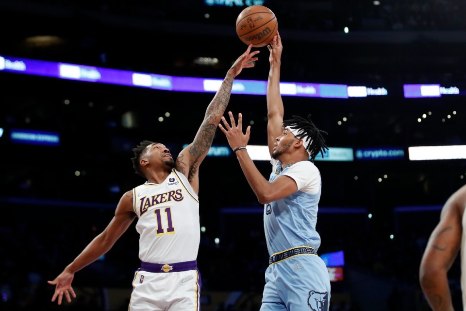 <strong>Memphis Grizzlies guard Ziaire Williams, right, shoots over Los Angeles Lakers guard Malik Monk during the basketball game Sunday, Jan. 9, 2022, in Los Angeles.</strong> (AP Photo/Alex Gallardo)