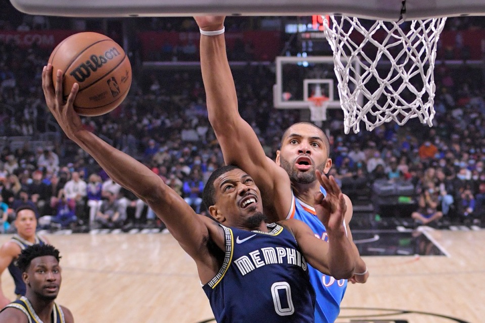 <strong>Memphis Grizzlies guard De'Anthony Melton, left, shoots as Los Angeles Clippers forward Nicolas Batum defends during the first half of an NBA basketball game Saturday, Jan. 8, 2022, in Los Angeles</strong>. (AP Photo/Mark J. Terrill)