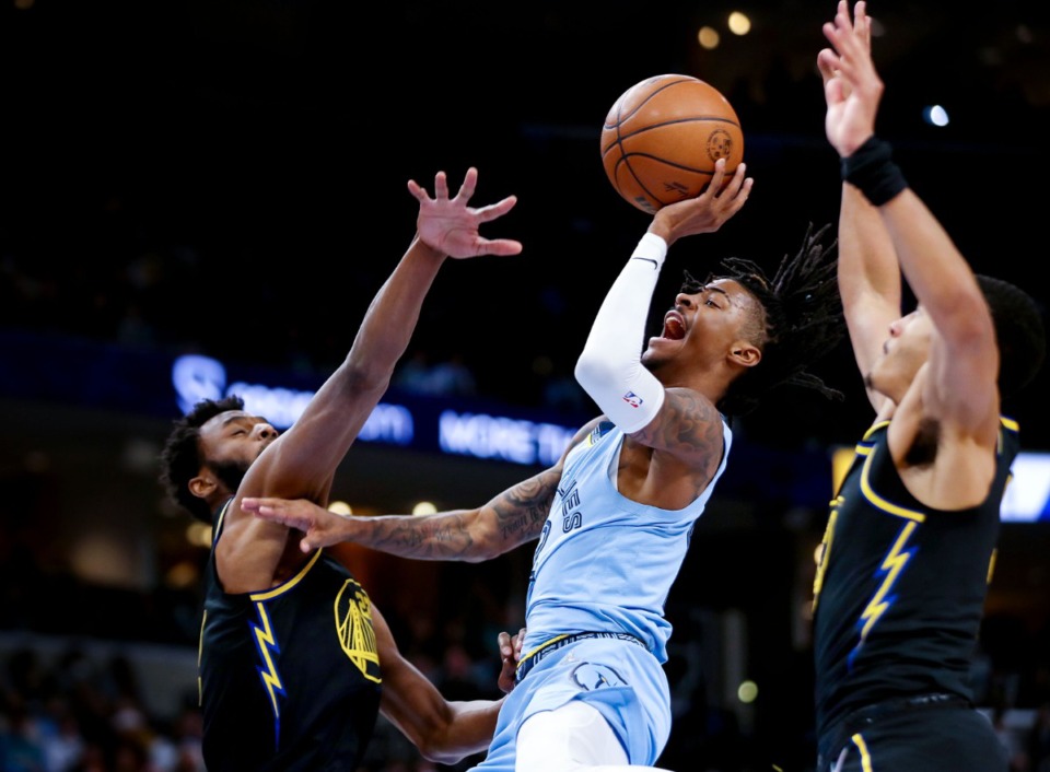 <strong>Grizzlies guard Ja Morant (12) goes in for a layup on Jan. 11 against the Golden State Warriors at FedExForum.</strong> (Patrick Lantrip/Daily Memphian)