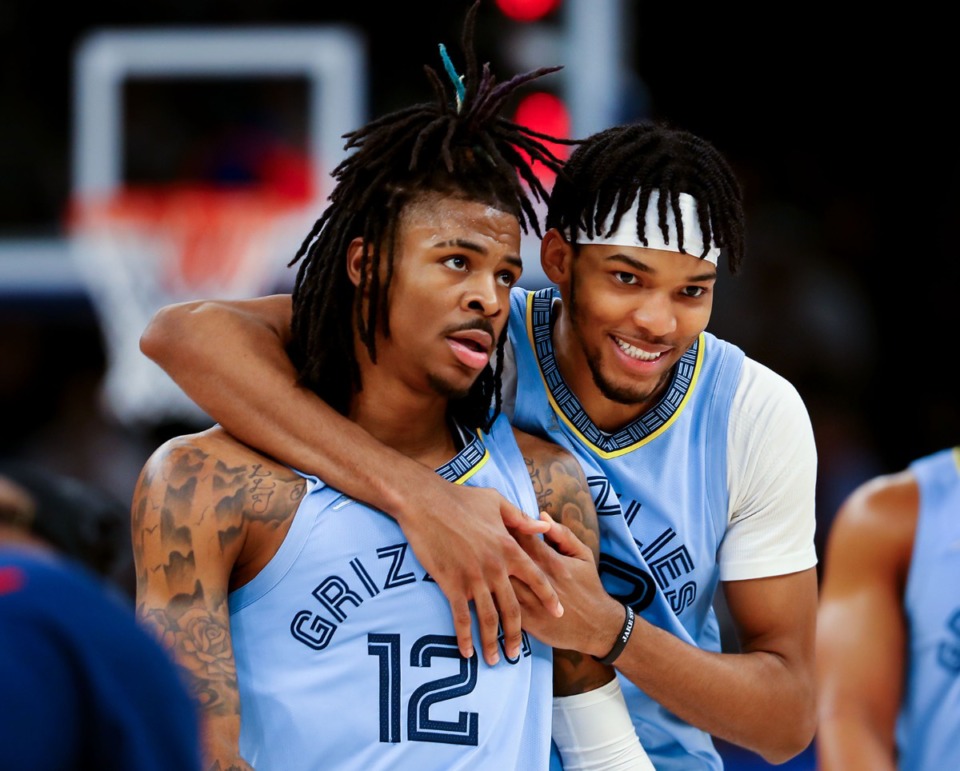 <strong>Grizzlies forward Ziaire Williams (8) hugs Ja Morant (12) on Jan. 11 in the game against the Golden State Warriors at FedExForum.</strong> (Patrick Lantrip/Daily Memphian)