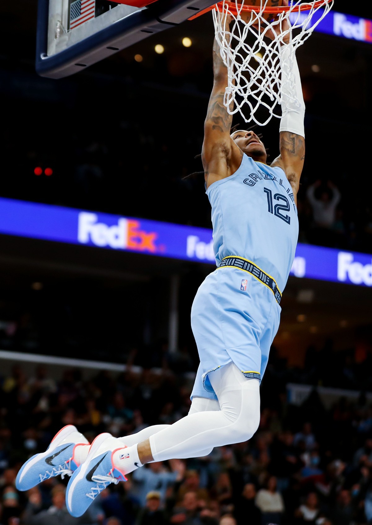 <strong>Grizzlies guard Ja Morant (12) dunks the ball during the Jan. 11 game against the Golden State Warriors at FedExForum.</strong> (Patrick Lantrip/Daily Memphian)