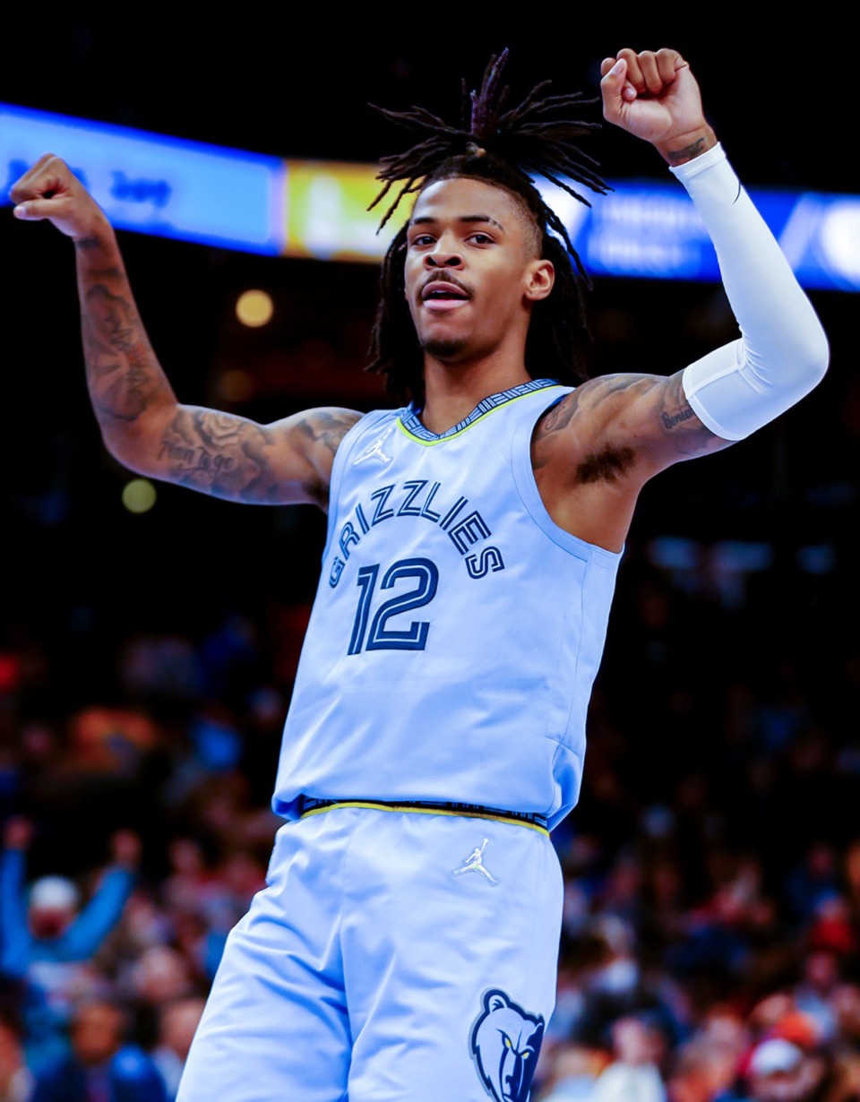 <strong>Grizzlies guard Ja Morant (12) celebrates after against the Golden State Warriors on Jan. 11 at FedExForum.</strong> (Patrick Lantrip/Daily Memphian)