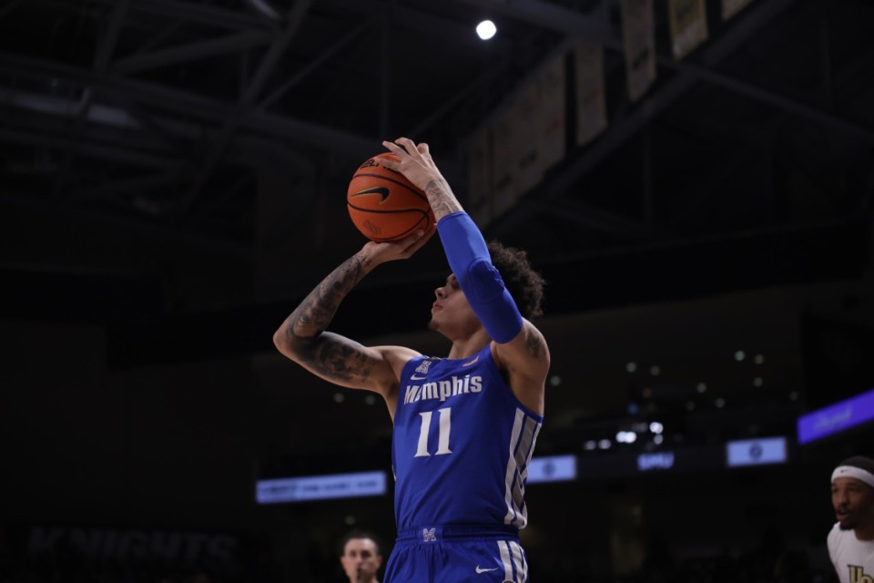 <strong>Memphis Tigers guard Lester Quinones (11) shoots against UCF on Jan. 12 in Florida.</strong> (Courtesy UCF Athletics)
