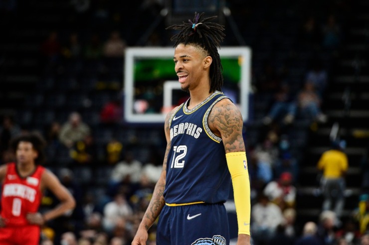 Memphis Grizzlies guard Ja Morant (12) reacts during the first half of an NBA basketball game against the Houston Rockets in November 2021. (AP Photo/Brandon Dill)