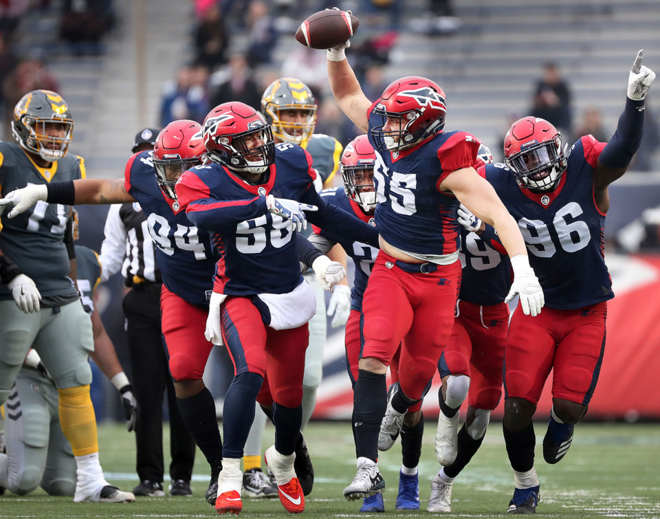 <strong>Davis Tull (55) of the Memphis Express celebrates with teammates after an interception against the San Diego Fleet during their Alliance of American Football league game at the Liberty Bowl in Memphis on March 2, 2019.</strong> (Jim Weber/Daily Memphian)