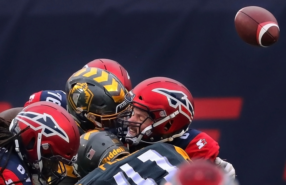 <strong>Myles Nash (91) of the San Diego knocks away a pass attempt by Memphis Express quaterback Zach Mettenberger (8) during their AAF league game at the Liberty Bowl on March 2, 2019.</strong> (Jim Weber/Daily Memphian)