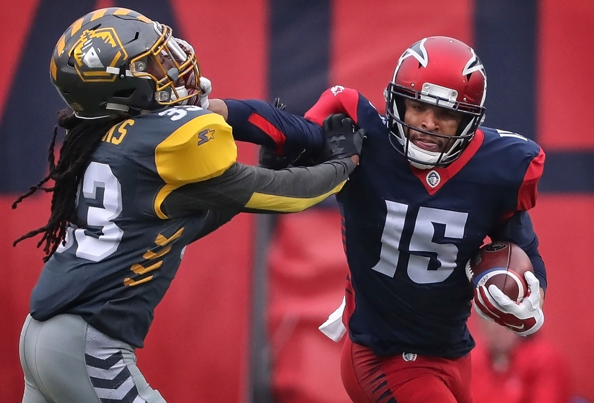 <strong>Memphis Express Devin Lucien (15) straight arms a San Diego Fleet defender on a run during their AAF league game at the Liberty Bowl on March 2, 2019.</strong> (Jim Weber/Daily Memphian)
