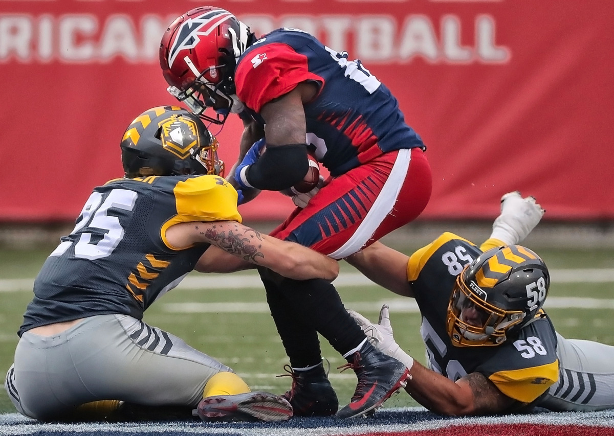 <strong>Memphis Express running back Zac Stacy (center) is taken down for a short gain against the San Diego Fleet during their AAF league game at the Liberty Bowl on March 2, 2019.</strong> (Jim Weber/Daily Memphian)