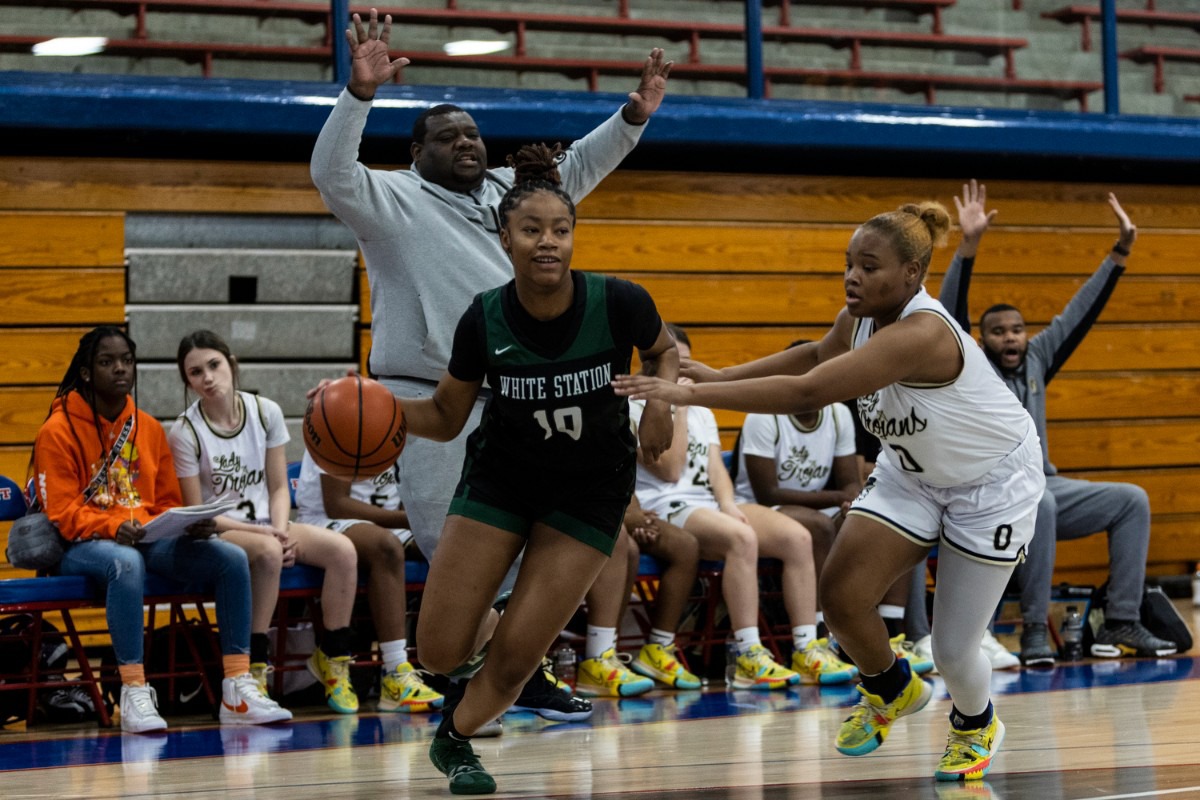 <strong>Demi Gentry of White Station High School dribbles toward the hoop at Bartlett High School on Saturday, Jan. 15, 2022.</strong> (Brad Vest/Special to The Daily Memphian)