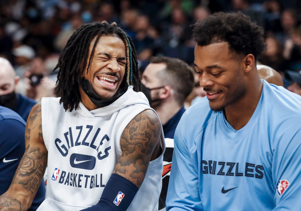 <strong>Memphis Grizzlies guard Ja Morant (left) jokes with teammate Xavier Tillman (right) on the bench during action against Minnesota on Thursday, Jan. 13, 2022. The Grizzlies get to host a national TV game on MLK Day again this season, and both players appreciate what MLK Day means to the City of Memphis.</strong> (Mark Weber/The Daily Memphian file)