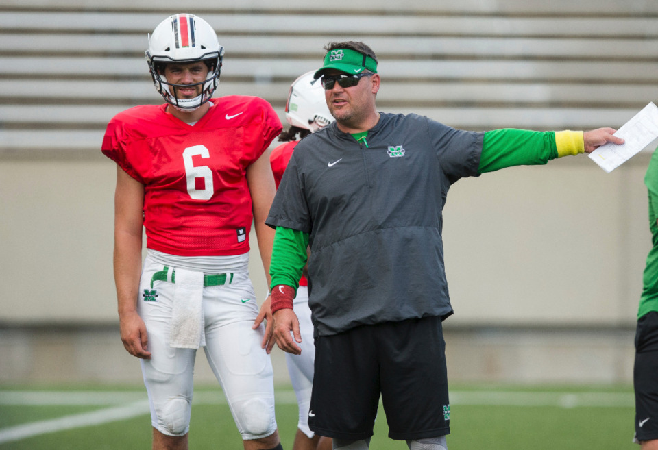 <strong>Marshall offensive coordinator Tim Cramsey works with the quarterbacks during the NCAA college football team's practice Tuesday, Aug. 7, 2018, in Huntington, W.Va. Cramsey is expected to be named the Memphis Tigers next offensive coordinator.</strong> (Sholten Singer/The Herald-Dispatch via AP)