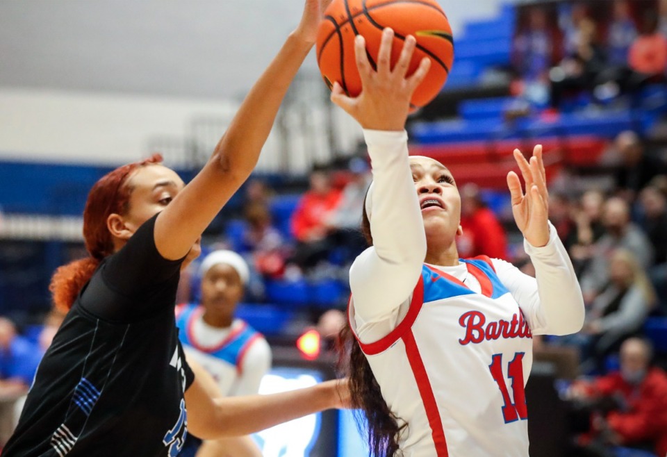 <strong>Bartlett guard Kennedy Claybrooks (right) drives the lane against MHEA during action on Thursday, Nov. 18, 2021.</strong> (Mark Weber/The Daily Memphian file)
