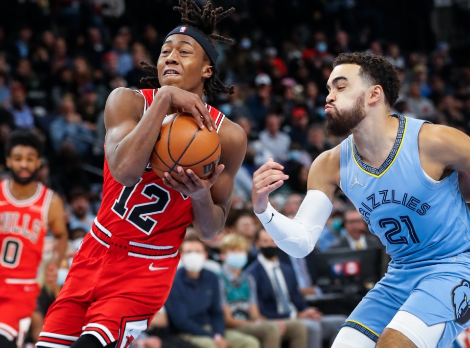 <strong>Chicago Bulls guard Ayo Dosunmu (left) drives by Memphis Grizzlies defender Tyus Jones during action on Monday, Jan. 17, 2022.</strong> (Mark Weber/The Daily Memphian)