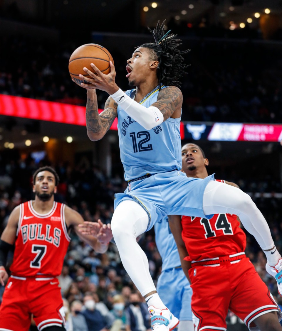 <strong>Memphis Grizzlies guard Ja Morant (middle) drives for a layup against the Chicago Bulls defense during action on Monday, Jan. 17, 2022.</strong> (Mark Weber/The Daily Memphian)
