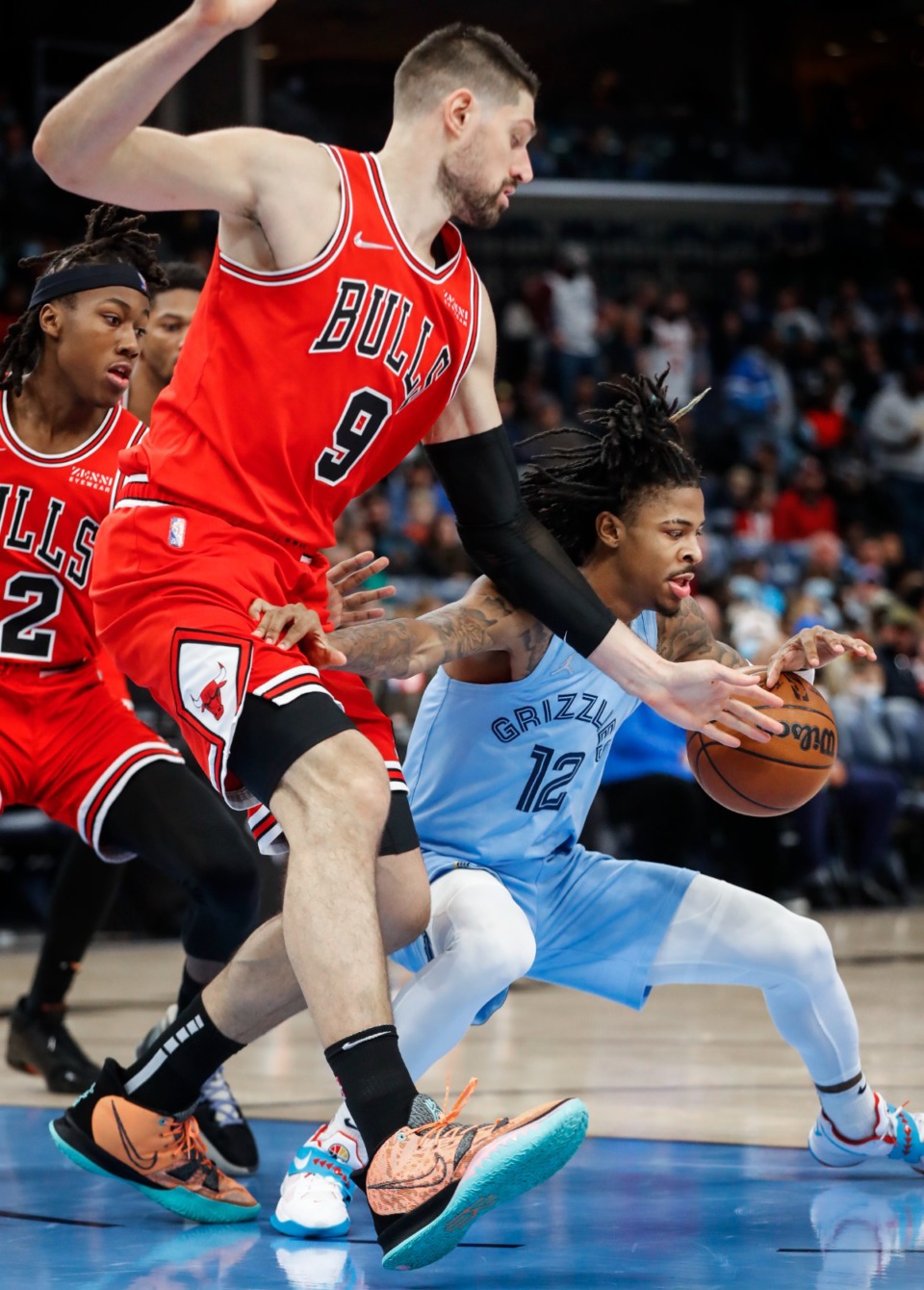 <strong>Memphis Grizzlies guard Ja Morant (right) grabs a loose ball while driving the lane against the Chicago Bulls defense during action on Monday, Jan. 17, 2022.</strong> (Mark Weber/The Daily Memphian)
