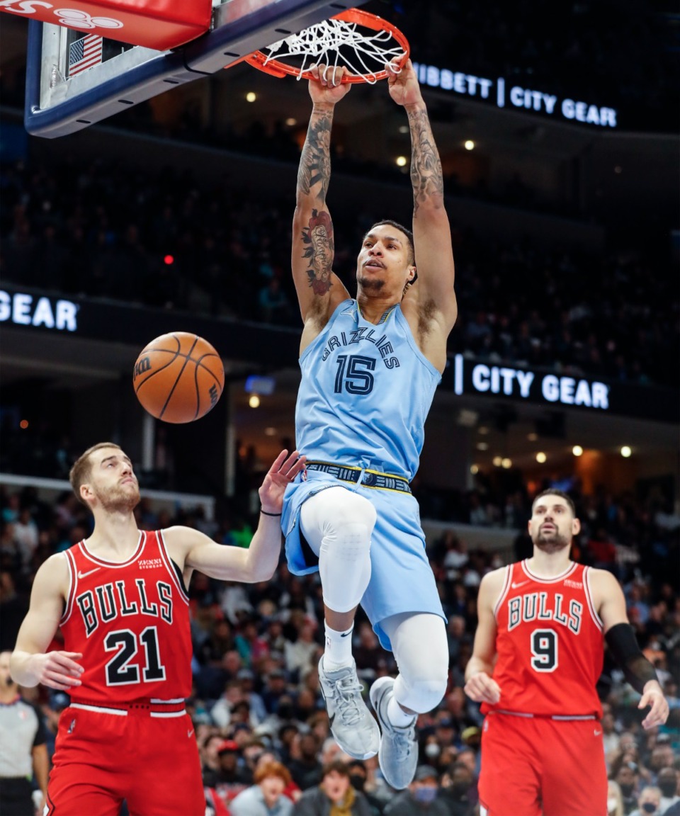 <strong>Memphis Grizzlies forward Brandon Clarke (middle) dunks over the Chicago Bulls defense during action on Monday, Jan. 17, 2022.</strong> (Mark Weber/The Daily Memphian)