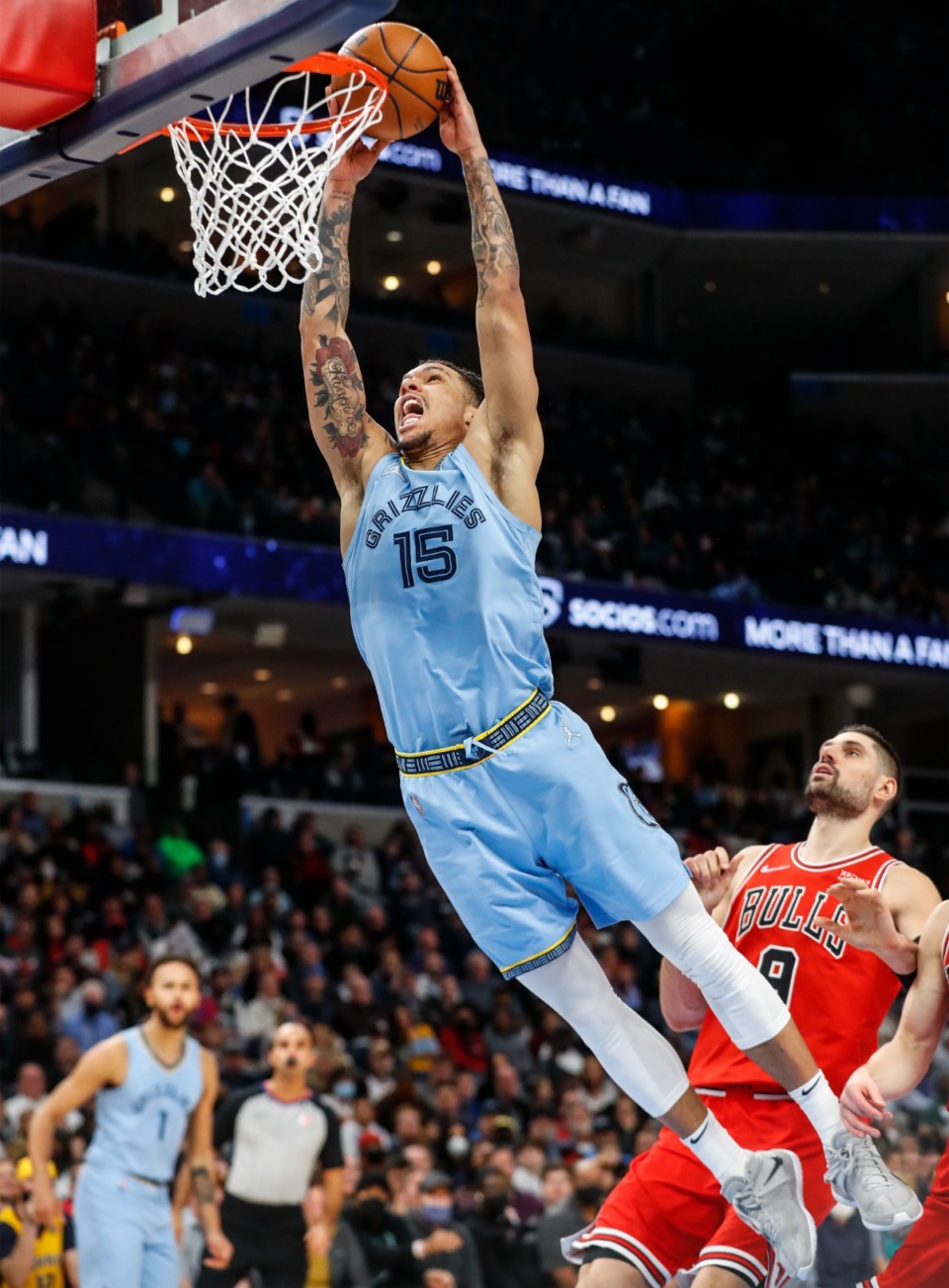 <strong>Memphis Grizzlies forward Brandon Clarke (middle) dunks over the Chicago Bulls defender Nikola Vucevic (right) during action on Monday, Jan. 17, 2022.</strong> (Mark Weber/The Daily Memphian)