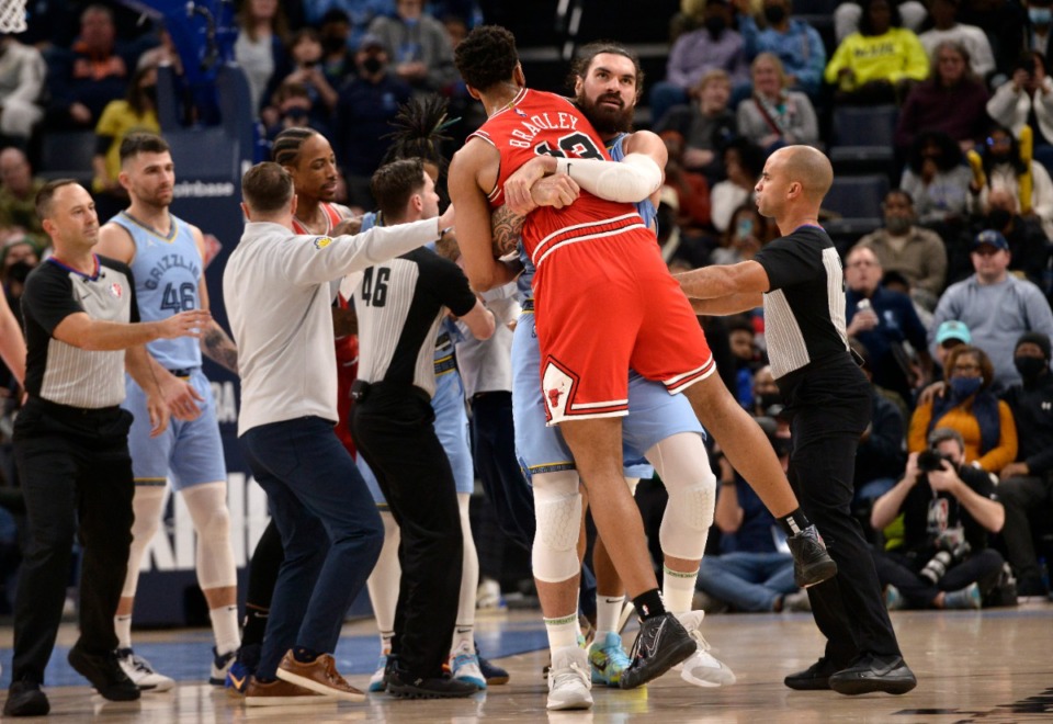 <strong>Memphis Grizzlies center Steven Adams, center right, carries Chicago Bulls center Tony Bradley (13) during an altercation between Bradley and Grizzlies guard Ja Morant in the second half of an NBA basketball game Monday, Jan. 17, 2022, in Memphis, Tennessee.</strong> (AP Photo/Brandon Dill)