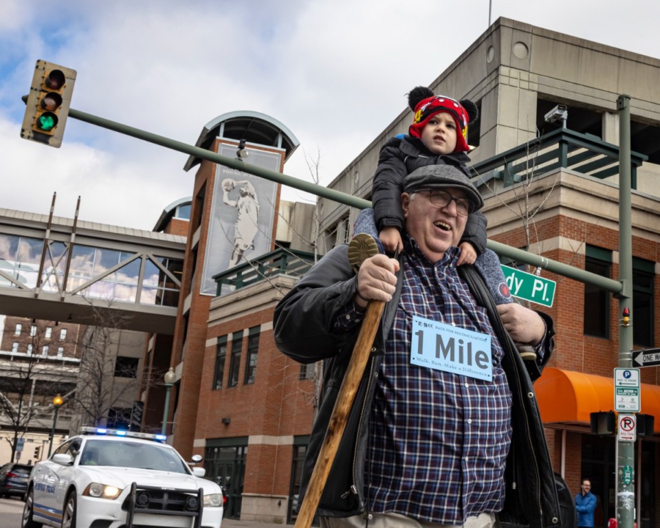 <strong>Marc Oppenhuizen and grandson Luke participate in the 1 Mile walk/run portion of the inaugural Race for Reconciliation&nbsp;in Downtown Memphis&nbsp;on Jan. 17, 2022.</strong> (Ziggy Mack/Special to The Daily Memphian)