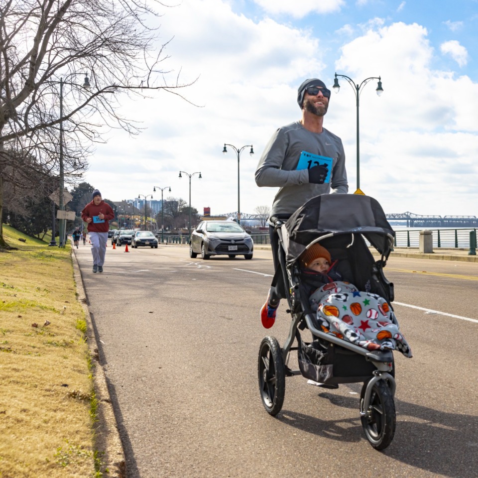 <strong>Kyle Krebs and son Jamyson participate in the 5k run portion of the inaugural Race for Reconciliation&nbsp;in Downtown Memphis&nbsp;on Jan. 17, 2022.</strong> (Ziggy Mack/Special to The Daily Memphian)