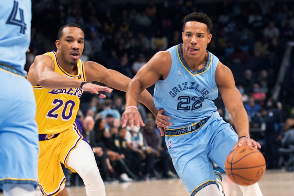 <strong>Los Angeles Lakers guard Avery Bradley (20) defends against Memphis Grizzlies guard Desmond Bane (22) during the first half of an NBA basketball game Thursday, Dec. 9, 2021, in Memphis.</strong> (AP Photo/Nikki Boertman)