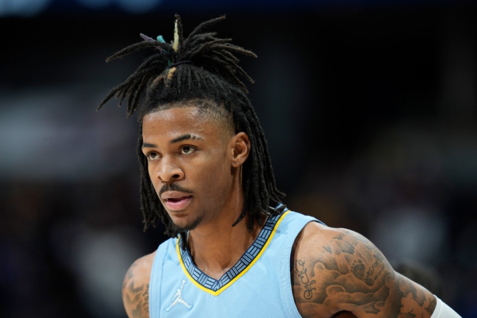 <strong>Grizzlies guard Ja Morant pauses during the game against the Denver Nuggets on Friday, Jan. 21, 2022, in Denver. (</strong>David Zalubowski/AP)