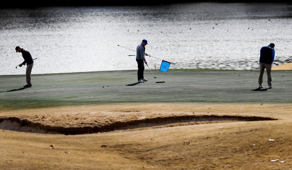 <strong>Golfers line up their putts on hole 16 at the Colonial Country Club Monday, Feb. 3, 2020.&nbsp;A planned mixed-use development adjoining the Colonial Country Club is moving forward.&nbsp;</strong>(Mark Weber/Daily Memphian file)