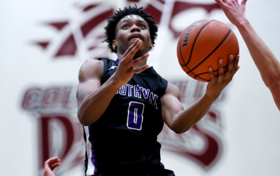 <strong>Southwind guard Chris Martin (0) goes for a layup in the game against Collierville on Jan. 25.</strong> (Patrick Lantrip/Daily Memphian)