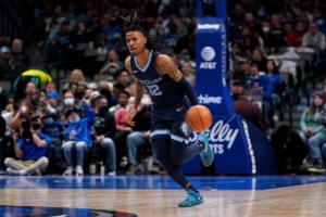 <strong>Memphis Grizzlies guard Ja Morant advances the ball during an NBA basketball game against the Dallas Mavericks in Dallas, Sunday, Jan. 23, 2022.</strong> (AP Photo/Tony Gutierrez)