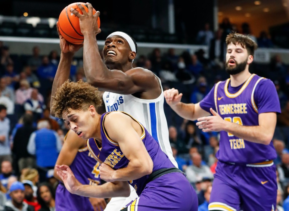 <strong>Memphis Tigers center Jalen Duren (middle) grabs a rebound against the Tennessee Tech defense during action.</strong> (Mark Weber/The Daily Memphian file)