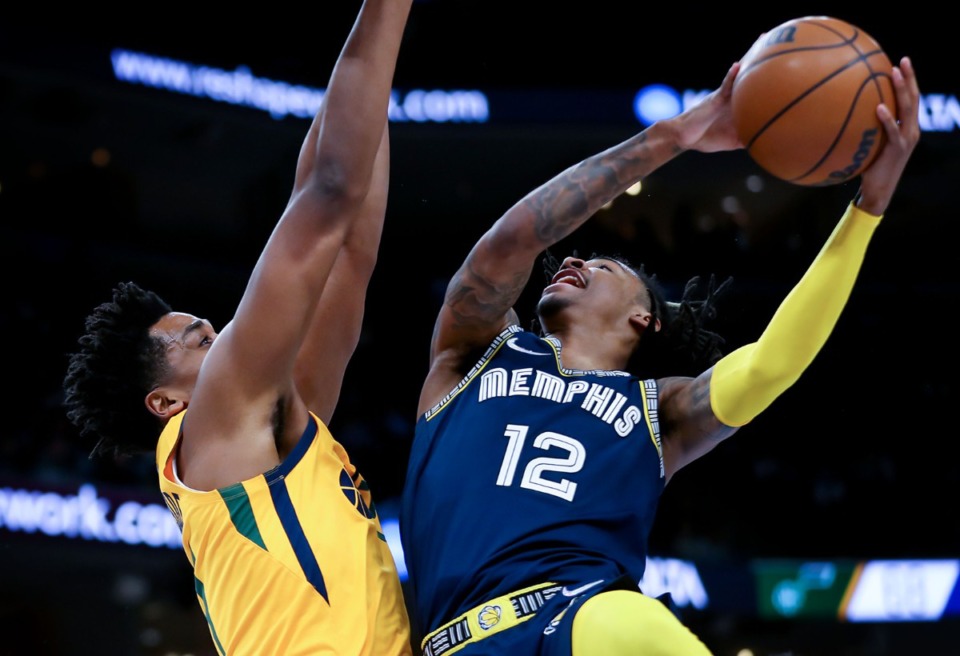 <strong>Memphis Grizzlies guard Ja Morant (12) fights for a layup on Jan. 28 against the Utah Jazz.</strong> (Patrick Lantrip/Daily Memphian)