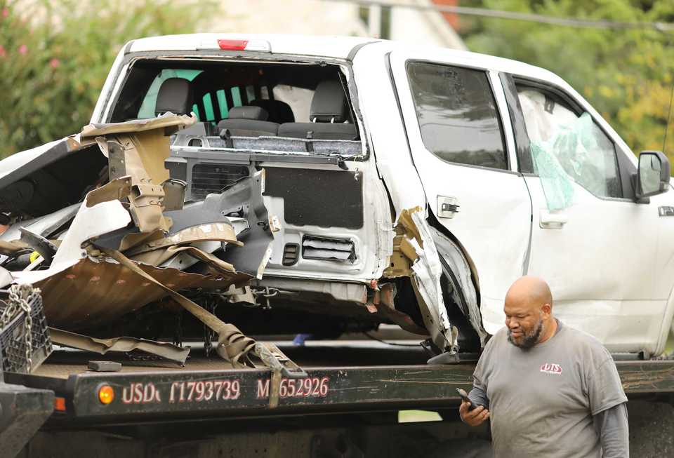<strong>Wreckers hauled away the pieces of a truck that crashed on McLemore Avenue while fleeing from Memphis Police officers.&nbsp;Police spotted a stolen pickup truck that matched the description of the one seen fleeing the scene where Phil Trenary, the head of the Greater Memphis Chamber, was shot and killed Downtown Thursday night.</strong>&nbsp;(Patrick Lantrip/Daily Memphian)