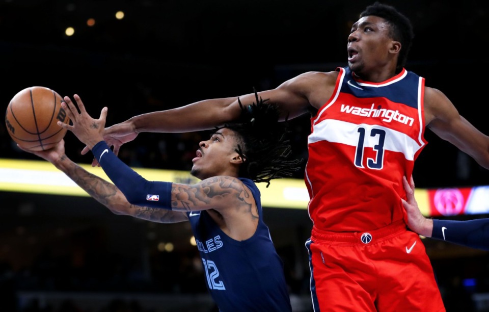 <strong>Memphis Grizzlies guard Ja Morant (12) goes up for a layup during a Jan. 29, 2022 game against the Washington Wizards.</strong> (Patrick Lantrip/Daily Memphian)
