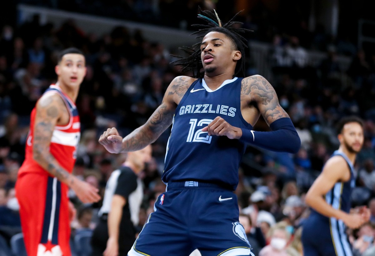 <strong>Memphis Grizzlies guard Ja Morant (12) dances after a big play during a Jan. 29, 2022 game against the Washington Wizards.</strong> (Patrick Lantrip/Daily Memphian)