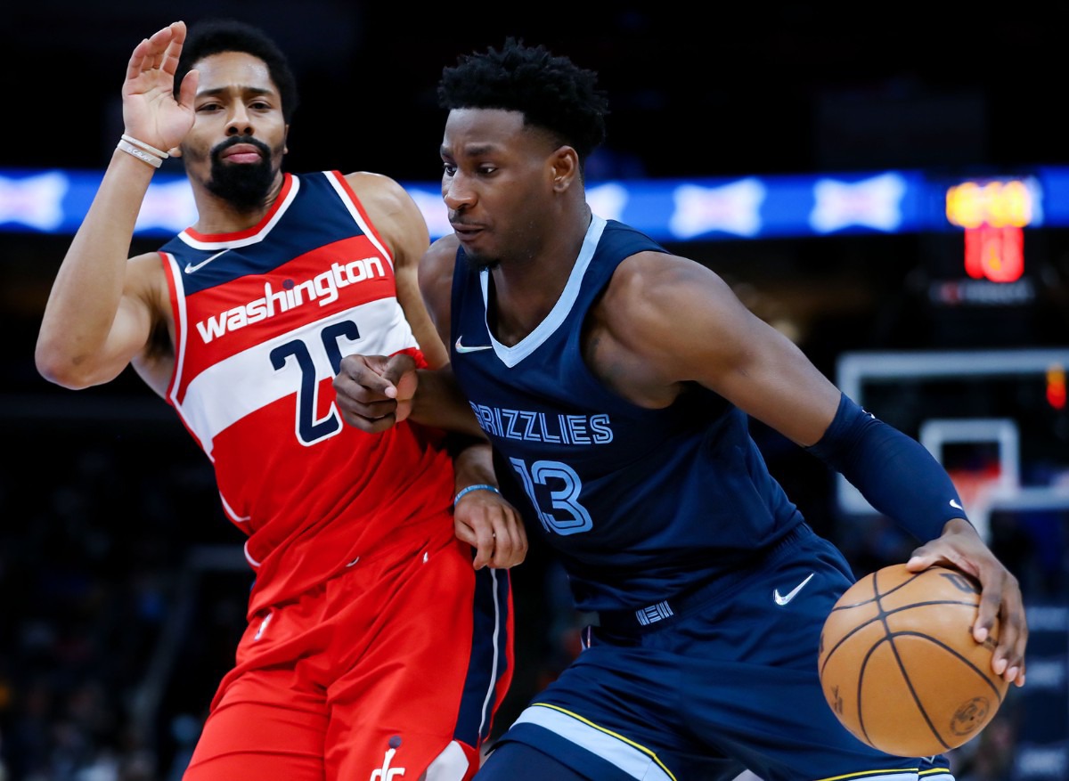 <strong>Memphis Grizzlies forward Jaren Jackson Jr. (13) drives to the basket against Washington Wizards guard Spencer Dinwiddie (26) during a Jan. 29, 2022 game at FedExForum.</strong> (Patrick Lantrip/Daily Memphian)