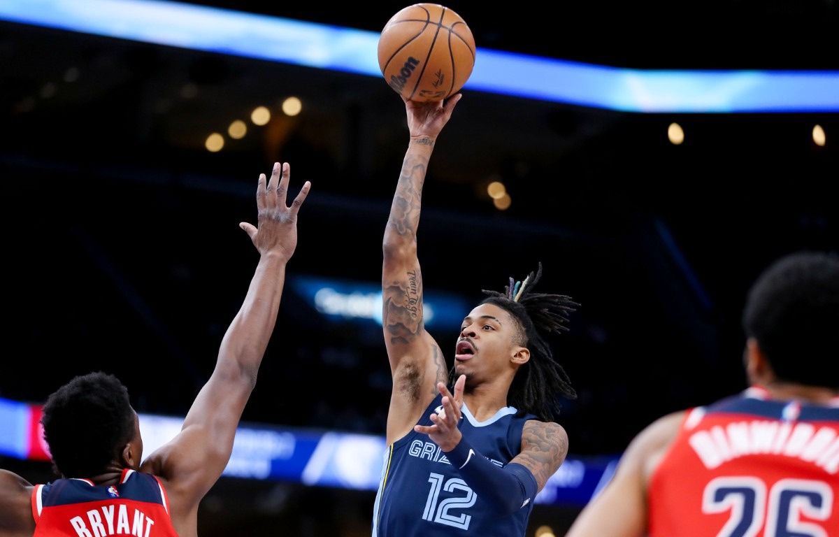 <strong>Memphis Grizzlies guard Ja Morant (12) shoots a floater during a Jan. 29, 2022 game against the Washington Wizards.</strong> (Patrick Lantrip/Daily Memphian)